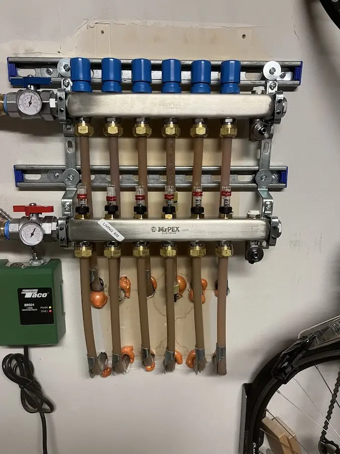 Plumber performing Sink Repair at a residential property in L'Anse